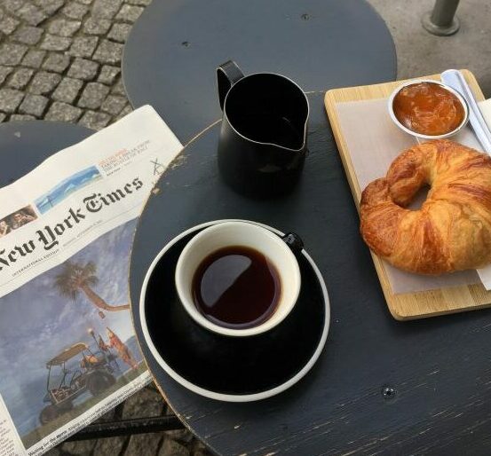 Newspaper and breakfast on a table