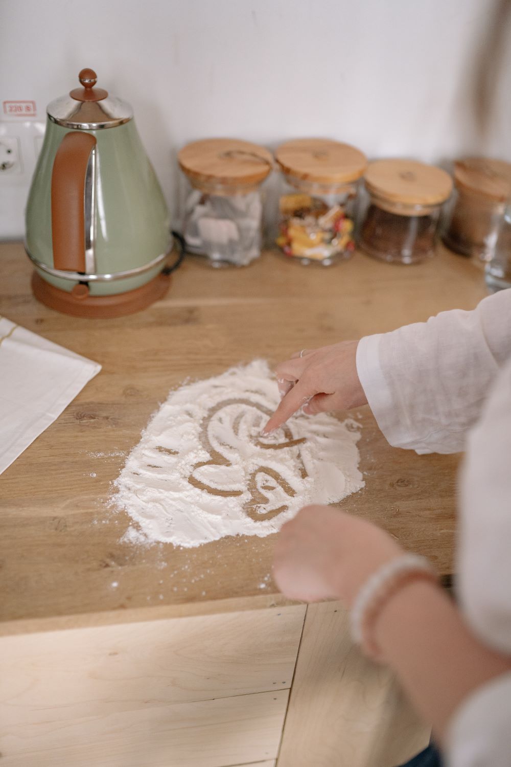 heart drawn in flour on counter top