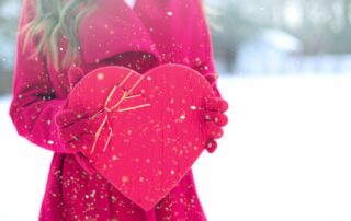 women in red with fancy red heart