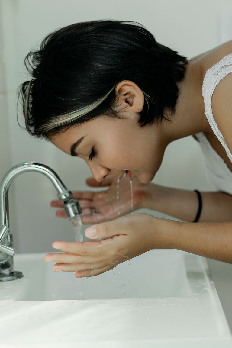 girl at faucet 