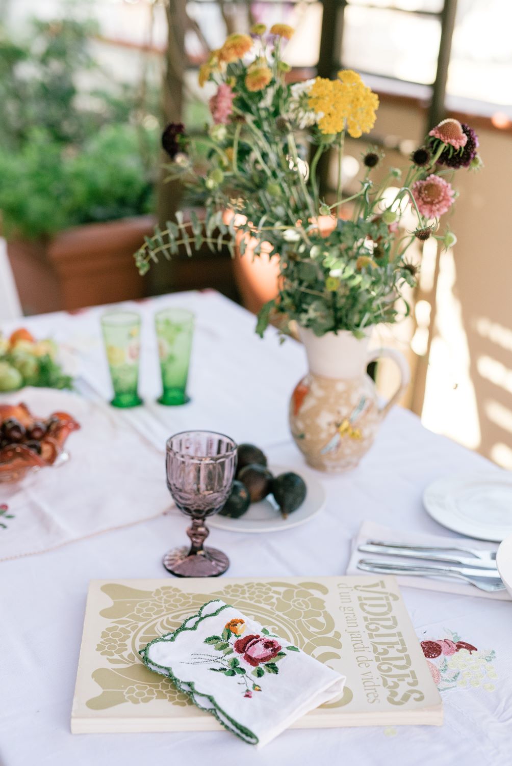 table setting with glassware and dishes