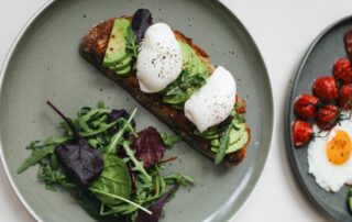 avocado toast and salad on plate