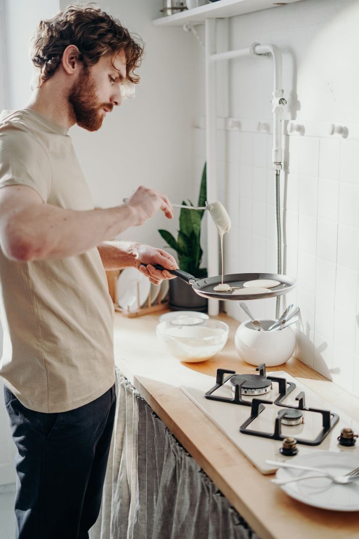 man making dinner